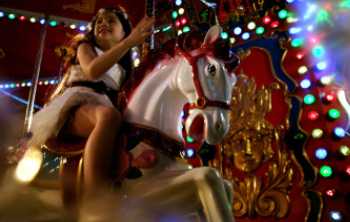 Kids riding on carousel