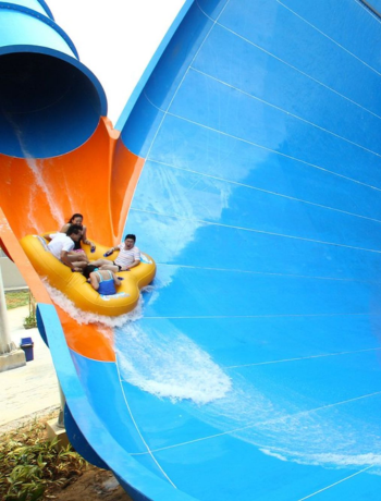 Adults playing in super slides